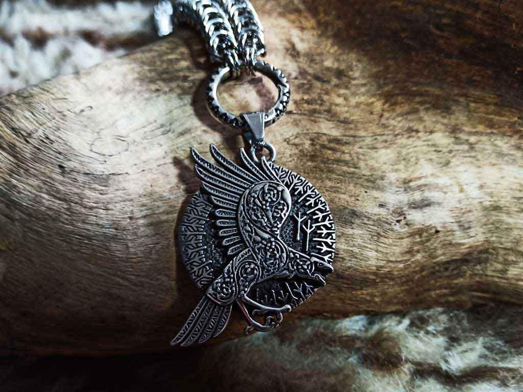 Runic raven on a dragon link chain