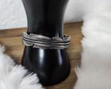 Edelstahlarmreif in Federform